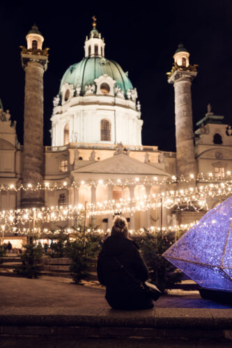 Adriana in front of St. Charles Church (Karlskirche) during the Christmas market season.