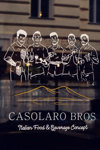 Casolaro Bros restaurant, featuring an illustration, likely representing the "brothers" behind the concept.