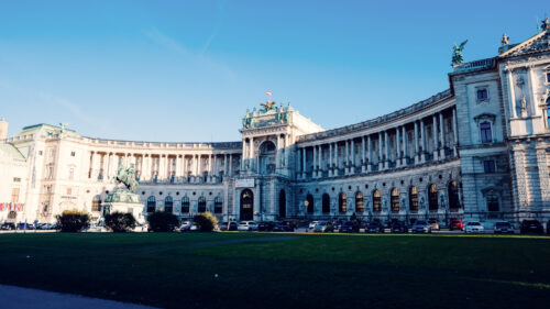 Summer view of the Neue Burg, showcasing its impressive architecture at Heldenplatz.