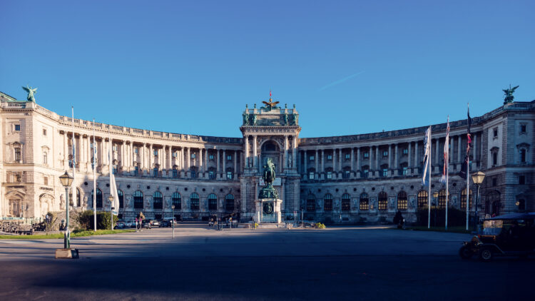 Magnificent Neue Burg at Heldenplatz on a bright summer day.