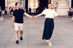 Adriana and Mario hand in hand at Michaelerplatz.