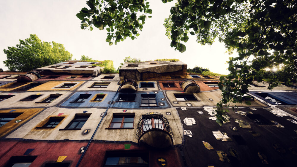 Playful architectural elements at Hundertwasserhaus where no straight lines exist, demonstrating Hundertwasser's philosophy of harmony with nature.
