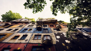 Playful architectural elements at Hundertwasserhaus where no straight lines exist, demonstrating Hundertwasser's philosophy of harmony with nature.