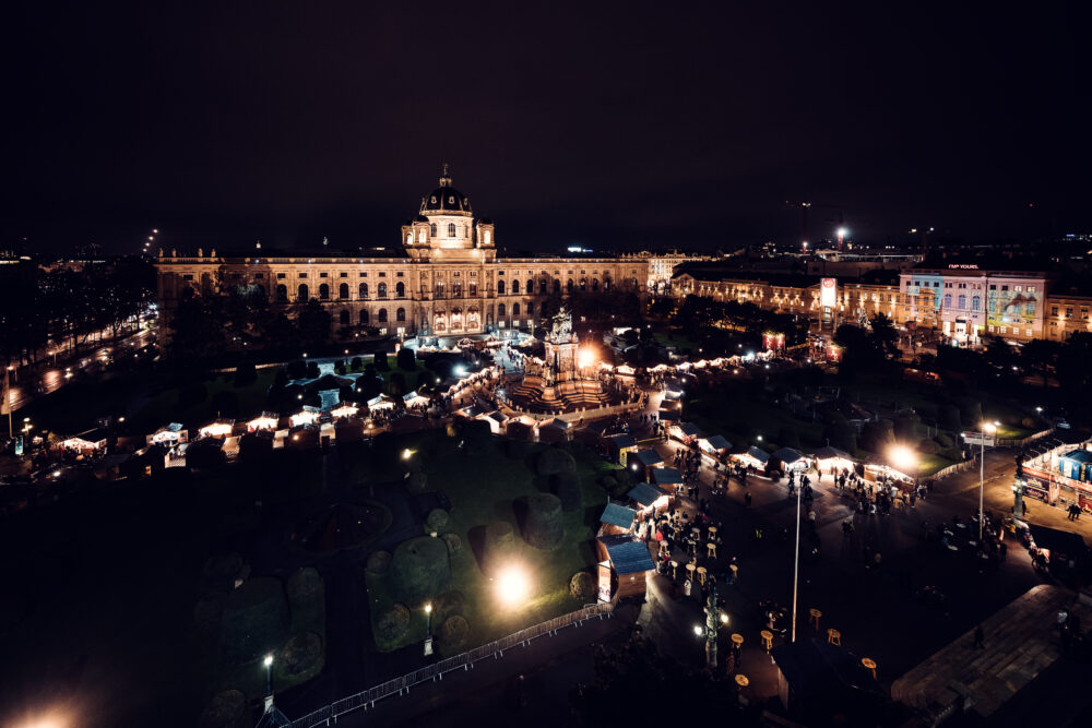 The Kunsthistorisches Museum Vienna by night, with the Christmas market in front on Maria-Theresien-Platz