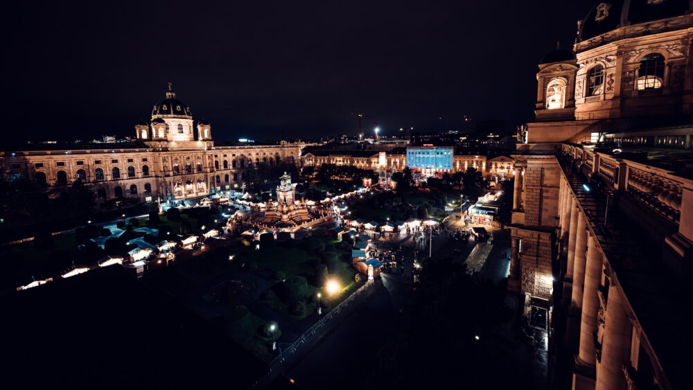 The Kunsthistorisches Museum Vienna by night, with the Christmas market in front on Maria-Theresien-Platz