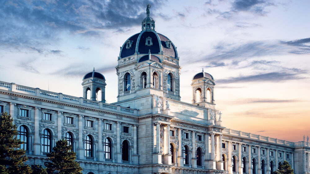 The Kunsthistorisches Museum Vienna features magnificent Neo-Renaissance architecture with rich decorations, imposing columns, and a large dome.