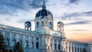 The Kunsthistorisches Museum Vienna features magnificent Neo-Renaissance architecture with rich decorations, imposing columns, and a large dome.
