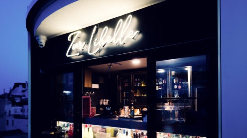 Evening atmosphere at Libelle bar Vienna with illuminated terrace and vibrant nightlife scene at MQ.