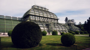 Side view of the Palm House showcasing its three climate pavilions, each section telling its own architectural story.