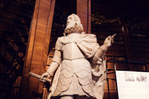 Imposing marble statue in the heart of the Prunksaal.