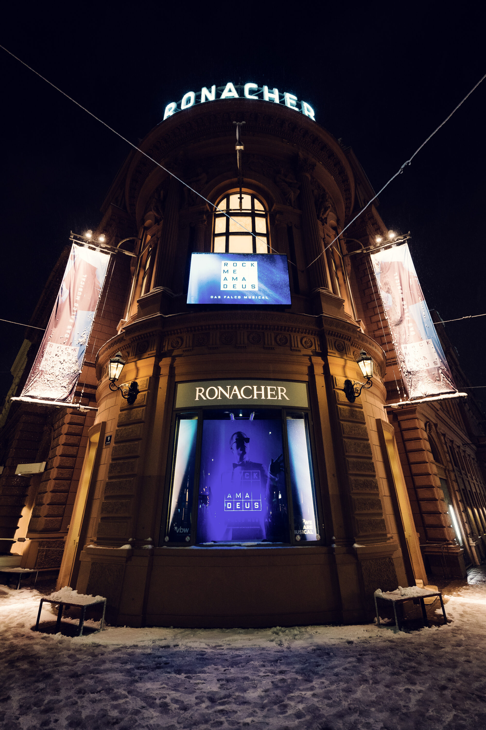 The beautifully illuminated entrance of the Ronacher Theater.