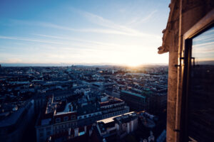 Spectacular panorama of Vienna's historic skyline from St. Stephen's Cathedral tower platform.