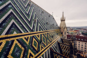 Iconic zigzag-patterned roof of St. Stephen's Cathedral, showcasing its distinctive colored tiles.