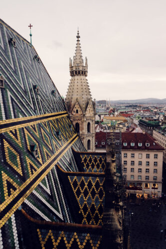 St. Stephen's Cathedral majestic tiled roof against Vienna's skyline.