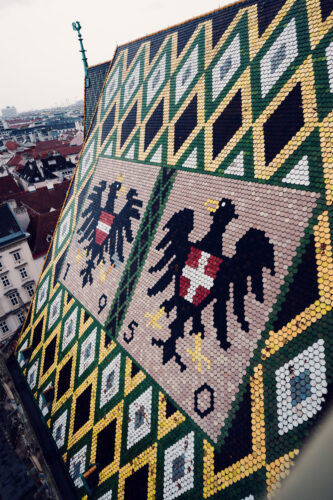 Close-up detail of St. Stephen's Cathedral's ornate roof mosaic, showcasing the intricate craftsmanship that makes this landmark instantly recognizable.
