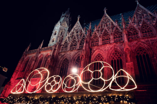 Dramatic night shot of St. Stephen's Cathedral, illuminated against the dark sky.