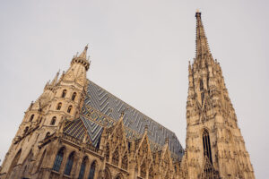 The majestic South Tower (Steffl) of St. Stephen's Cathedral soaring into Vienna's sky, its Gothic spire reaching a height of 136.4 meters.