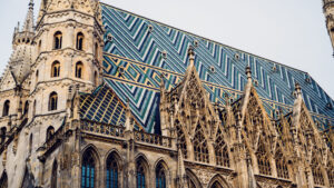 The legendary mosaic roof of St. Stephen's Cathedral in morning light, a fascinating pattern of 230,000 glazed tiles.