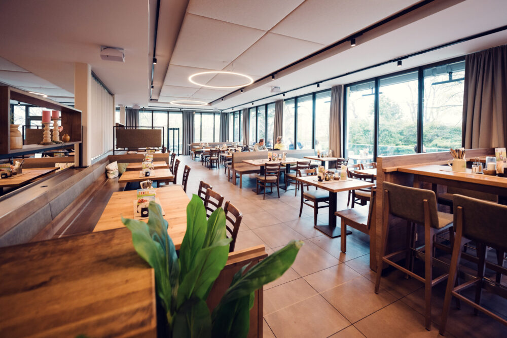 Main dining room of Stöckl im Park Vienna showcasing original architectural elements and contemporary interior design.