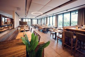 Main dining room of Stöckl im Park Vienna showcasing original architectural elements and contemporary interior design.