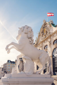Magnificent baroque horse sculpture at Belvedere Castle's entrance.