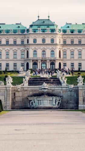 Framed view of Upper Belvedere through garden archways.