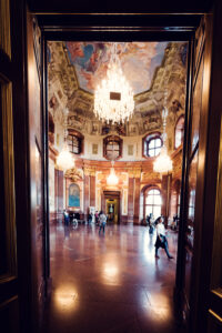 Magnificent Marble Hall of Belvedere Castle, where ceiling frescoes meet marble grandeur.