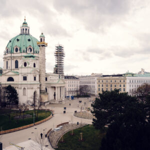 A scenic view from the Wien Museum, overlooking St. Charles Church (Karlskirche) and the surrounding plaza.