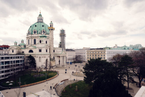 A scenic view from the Wien Museum, overlooking St. Charles Church (Karlskirche) and the surrounding plaza.