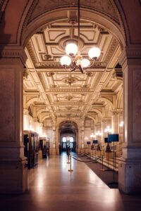 Side view of the grand marble staircase at the Vienna State Opera.