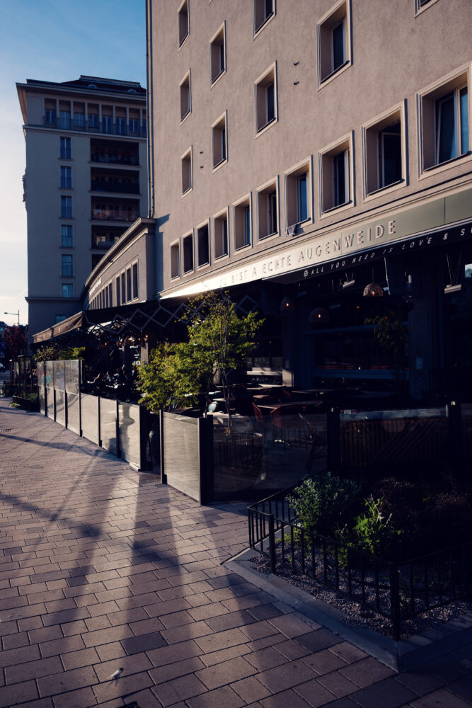 A sunny summer day on the outdoor terrace of augenwide in Vienna.