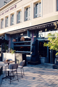 A sunny summer day on the outdoor terrace of augenwide in Vienna.