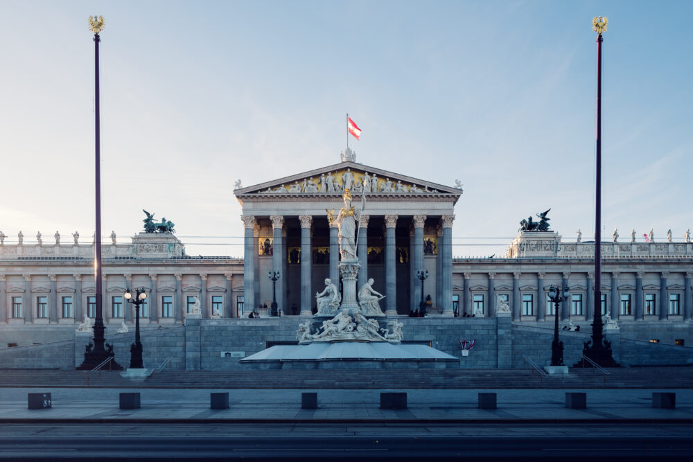 Austrian Parliament's neoclassical style, a testament to Vienna's heritage.