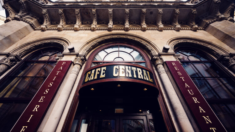 Grand main entrance of Café Central in Vienna, welcoming visitors with its historic charm and architectural elegance.