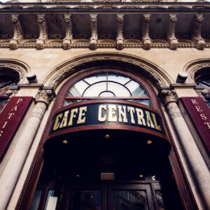 Grand main entrance of Café Central in Vienna, welcoming visitors with its historic charm and architectural elegance.