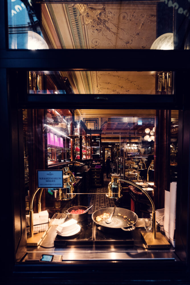 Café Demel's pastry chefs at work, crafting exquisite Kaiserschmarrn in Vienna.