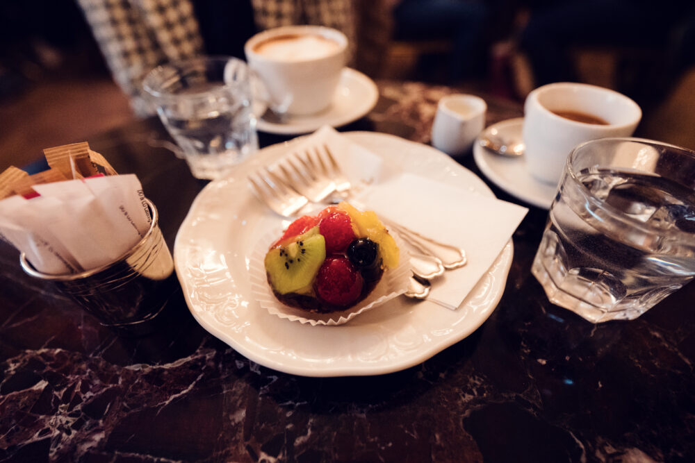 Café Demel's beautifully decorated cakes, perfect for any occasion.