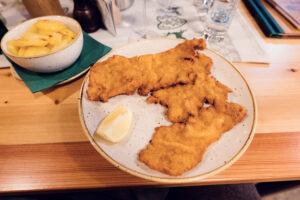 Crispy Wiener Schnitzel at Heuriger Mayer am Pfarrplatz, a Austrian delight.