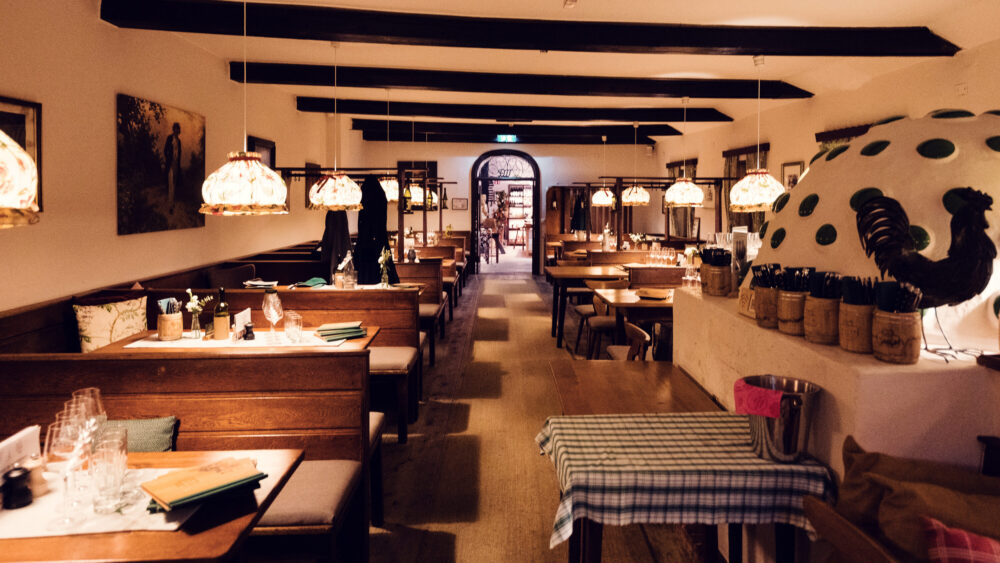 Warm and inviting interior of Heuriger Mayer am Pfarrplatz, blending rustic charm with modern comfort.
