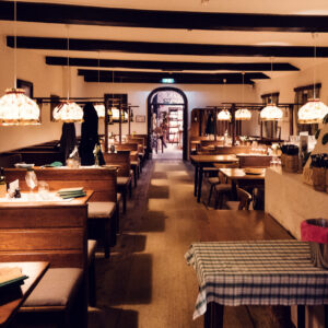 Warm and inviting interior of Heuriger Mayer am Pfarrplatz, blending rustic charm with modern comfort.