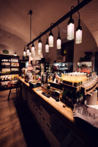 Charming shop at Heuriger Mayer am Pfarrplatz, showcasing a variety of Austrian wines and delicacies.