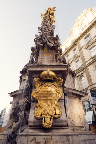 The coats of arms represent the Habsburg Monarchy, emphasizing the emperor's role as a ruler chosen by God.