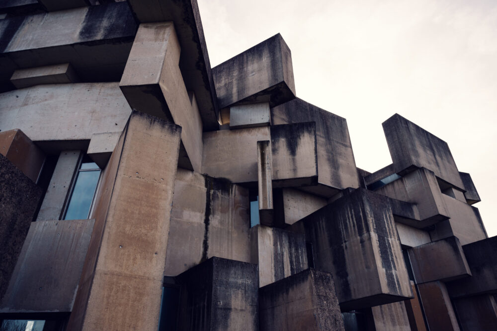 Close-up of Wotrubakirche's geometric facade, highlighting its bold and unconventional structure.