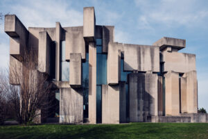 Artistic angle of Wotrubakirche, capturing the interplay of light and shadow on its concrete surfaces.