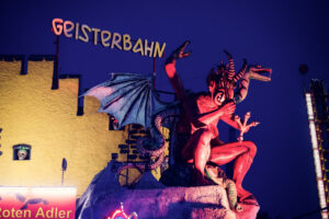 Geisterbahn ghost train at Wiener Prater Vienna Austria, traditional haunted house attraction with spooky facade and classic amusement park design in historic Prater.