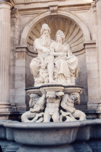 Detailed sculpture of a fountain near the Albertina Museum entrance.