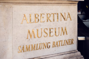 Close-up of the Albertina Museum sign with Sammlung Batliner collection mentioned.