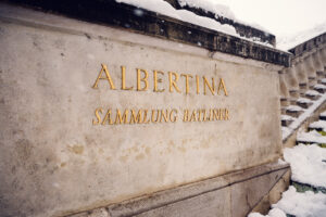 Close-up of Albertina Museum sign highlighting Sammlung Batliner collection.