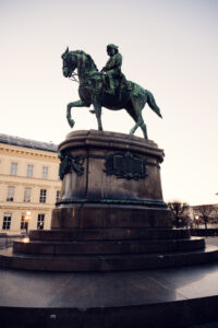 Equestrian statue of Archduke Albrecht surrounded by classical architecture in Vienna.