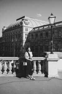 Black and white photo on the Albertina Museum terrace with a view on the State Opera in Vienna.